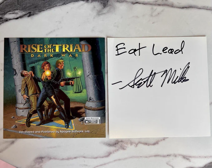A Rise of the Triad Jewel Case Insert that is signed by Apogee’s Scott Miller.