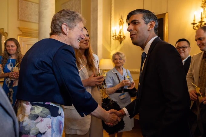 Prime Minister Rishi Sunak attends an NHS 75th Birthday reception in Downing Street and shakes the hand of an NHS staff member.