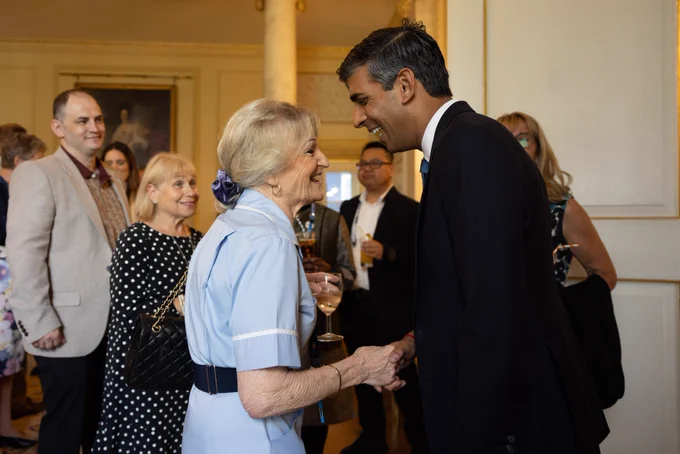 Prime Minister Rishi Sunak attends an NHS 75th Birthday reception in Downing Street and shakes the hand of an NHS staff member.