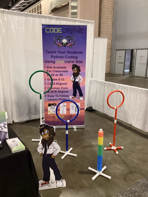 CodeDrone is show. Sign says "Teach your Students Python Coding Using CodeDrone Kits. 