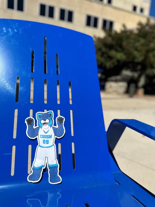 Flat Crash sitting in Tukwut Courtyard at CSUSM on a sunny day.