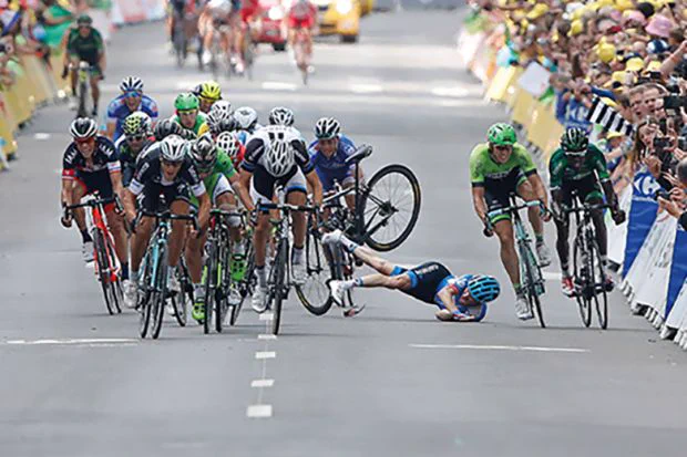 Andrew Talansky of Garmin-Sharp crashes in the sprint to the finish line in stage seven of the 2014 Tour de France, in Nancy on 11 July 2014.