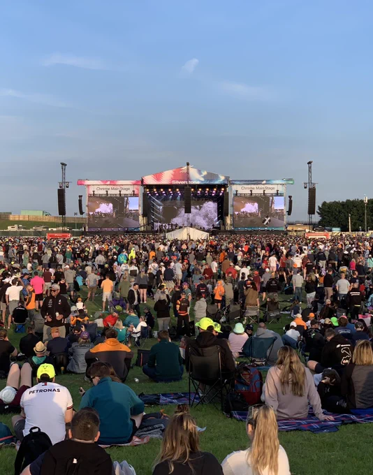 The view from the back of a large crowd watching Jess Glynne on stage
