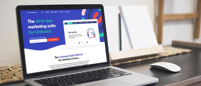 A laptop displaying the homepage for the all-in-one marketing suite for Umbraco
