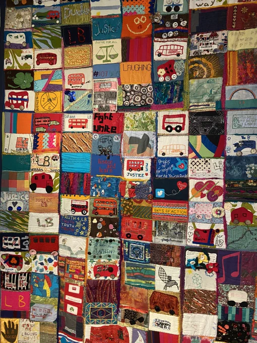 Quilt made up of lots of small patches with different images and patterns. Very colourful with lots of buses