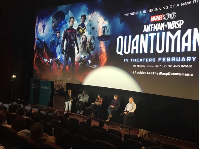 Panelists discuss 'Quantumania' in front of movie screen.