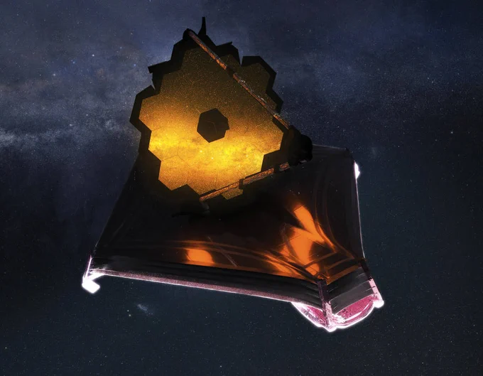Artist illustration of the Webb telescope floating in the vast darkness of space. The telescope's hexagonal mirror seems to glow gold, reflecting faint stars. Below the mirror is Webb's large, five-layer sunshield, which is roughly the shape of a kite. While it appears to be largely cast in shadow, some parts of it look as if they are reflecting the gold of the mirror. Overall, the sunshield structure seems made of a metallic, purple-tinged material.