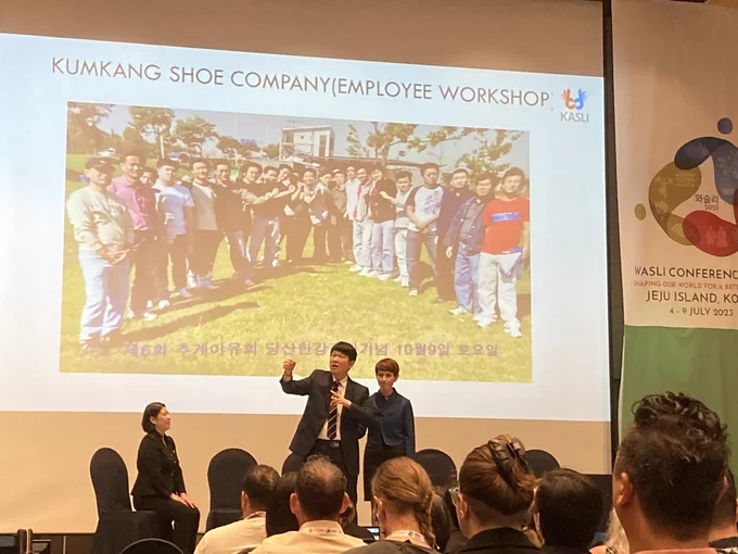 PowerPoint photo of employees of shoe company