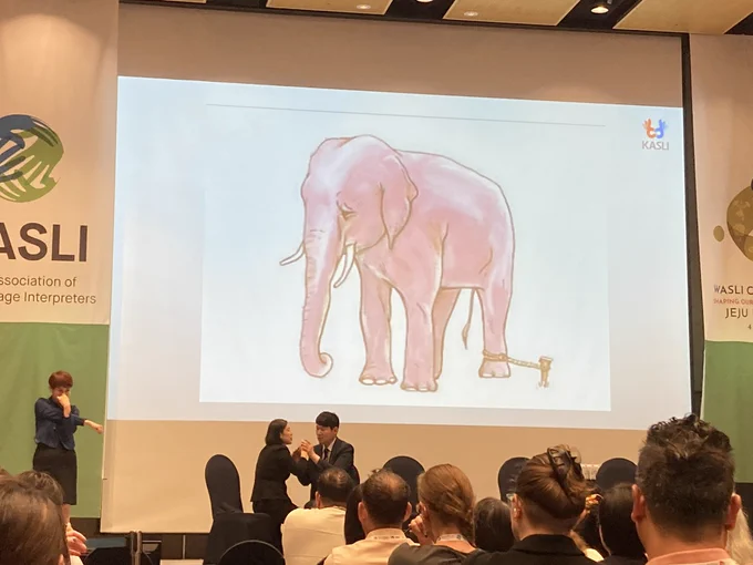 Picture of big elephant tied to a small peg in the ground