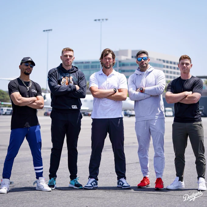 Mookie Betts, Freddie Freeman, Clayton Kershaw, JD Martinez and Will Smith pose for a photo at the airport.