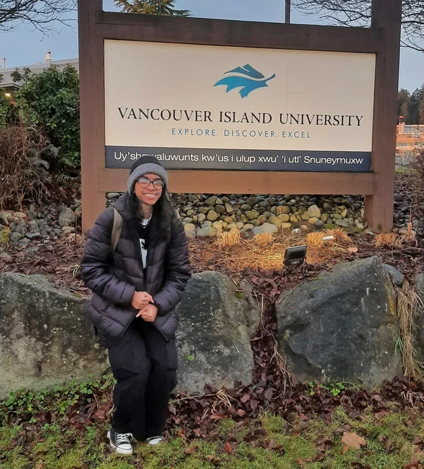 Becky with the VIU sign