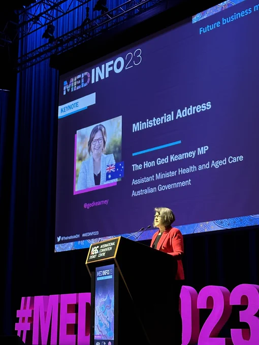 Ged Kearney standing at lectern on MedInfo stage