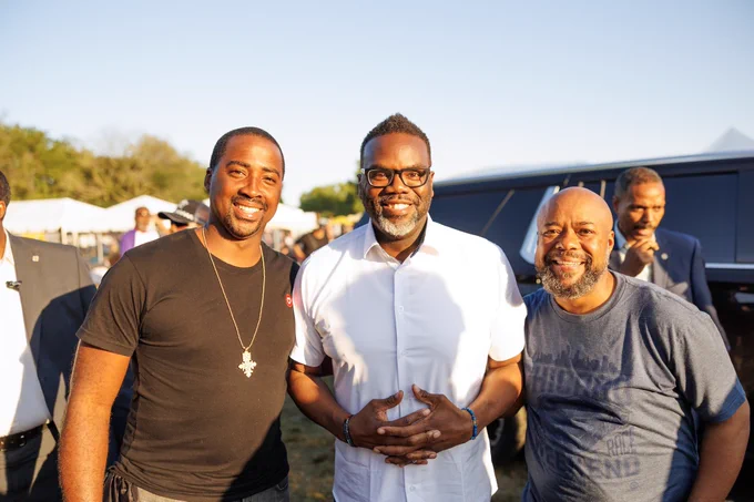Photo ID: Mayor Johnson poses with two individuals.