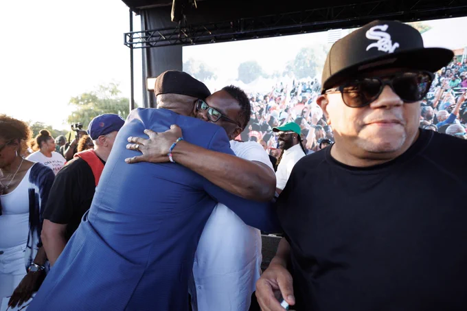 Photo ID: The mayor embraces an individual.