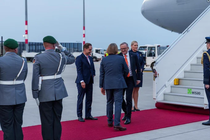 Ambassador Philip Green greeting Prime Minister Anthony Albanese. They are shaking hands.