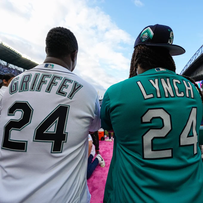Photo of the back of Ken Griffey Jr. and Marshawn Lynch, both wearing #24, at the Home Run Derby. 