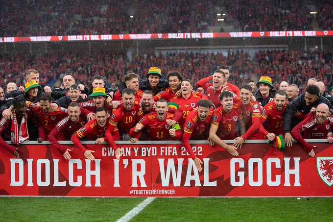 The Wales Men's Football Team celebrating after qualifying for the 2022 FIFA World Cup