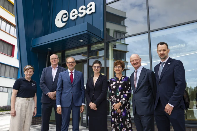 A group of men and women stand outside the new ESA conference centre in Harwell, Didcot.