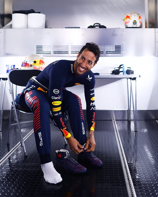 Daniel Ricciardo laces up his racing boots ahead of the Pirelli Tyre Test at Silverstone.