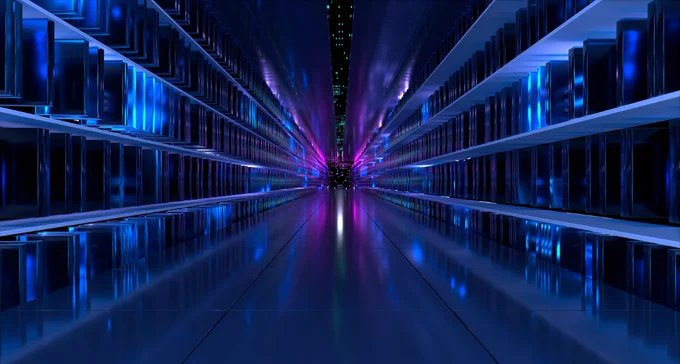 Photo of a dark hallway with shelves on each side with computers that almost look like books on them