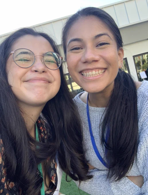 A selfie close up photo of two smiling people outdoors