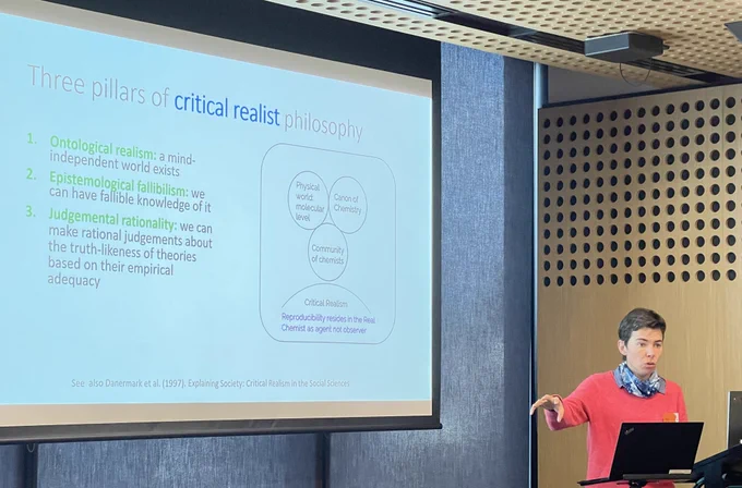 Mags with a slide showing the three pillars of critical realism
