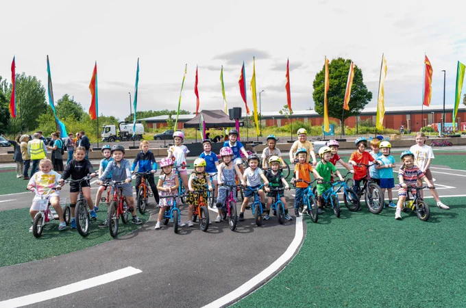 A group of young cyclists launch Liverpool's first learn-to-ride facility in Everton Park. The facility has been created by converting an underused concrete amphitheatre, using carbon-friendly asphalt.
