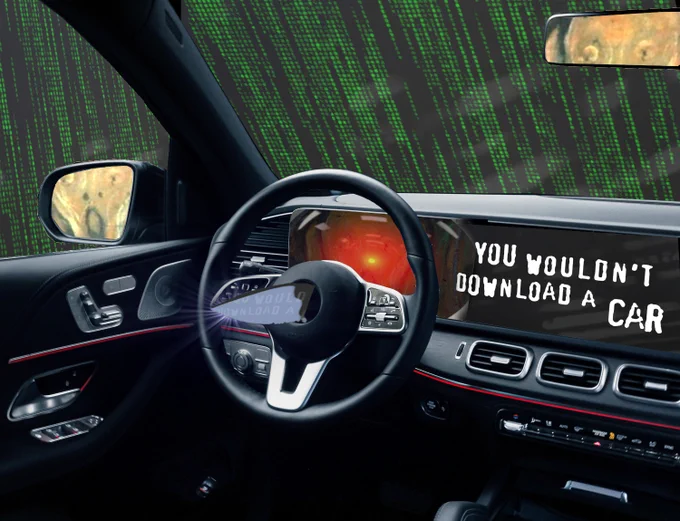 The interior of a luxury car. There is a dagger protruding from the steering wheel. The entertainment console has been replaced by the text 'You wouldn't download a car,' in MPAA scare-ad font. Outside of the windscreen looms the Matrix waterfall effect. Visible in the rear- and side-view mirror is the driver: the figure from Munch's 'Scream.' The screen behind the steering-wheel has been replaced by the menacing red eye of HAL9000 from Stanley Kubrick's '2001: A Space Odyssey.'

Image:
Cryteria (modified)
https://commons.wikimedia.org/wiki/File:HAL9000.svg
CC BY 3.0
https://creativecommons.org/licenses/by/3.0/deed.en
