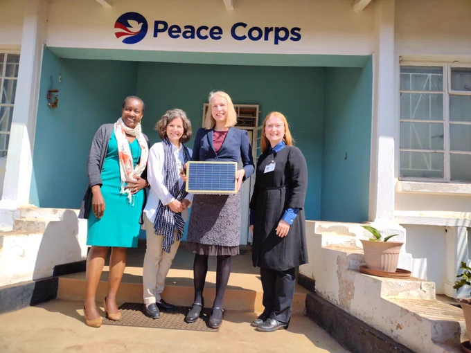 SolarSPELL directors Laura Hosman and Heather Ross pose in front of the Peace Corps Malawi office with Peace Corps Malawi's Country Director Amber Lucero-Dwyer and their AHP Coordinator Towela Nyika.