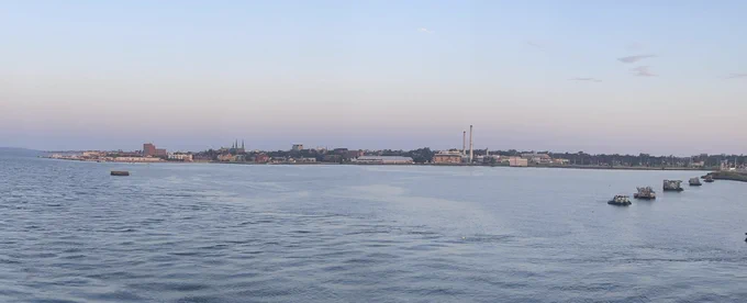 Water with city landscape in the background.
