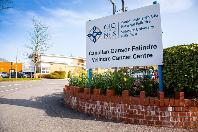 The front of Velindre Cancer Centre on a clear day.