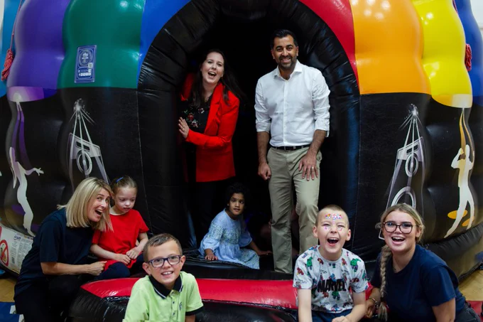 First Minister and SNP leader Humza Yousaf with Emma Roddick MSP and children at SNAP in Inverness.