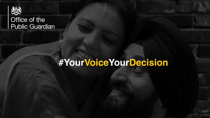 A couple hug. The image is in black and white. Text over the top shows the hashtag 'Your Voice, Your Decision'. #YourVoiceYourDecision