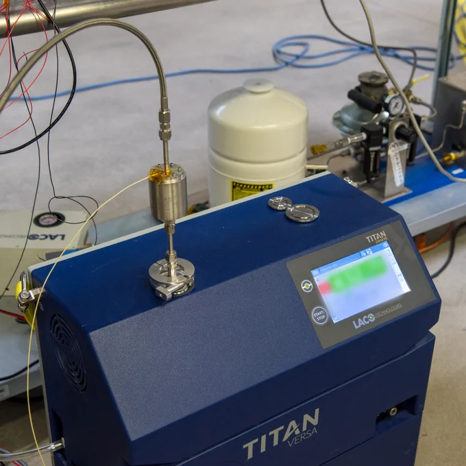 Closeup of helium leak detector machine and RAFTI test