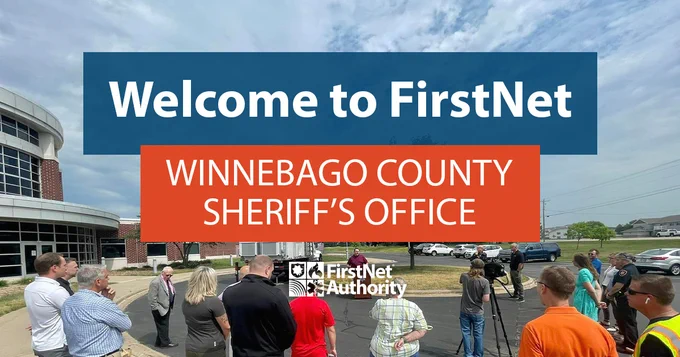 Winnebago County Sheriff’s Office holding an event outside with people standing around a podium; "Welcome to FirstNet; Winnebago County Sheriff’s Office"; FirstNet Authority logo