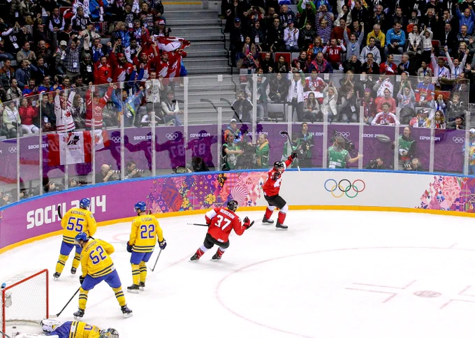 Crosby and Bergeron celebrate after a Team Canada goal in the Sochi Olympics.