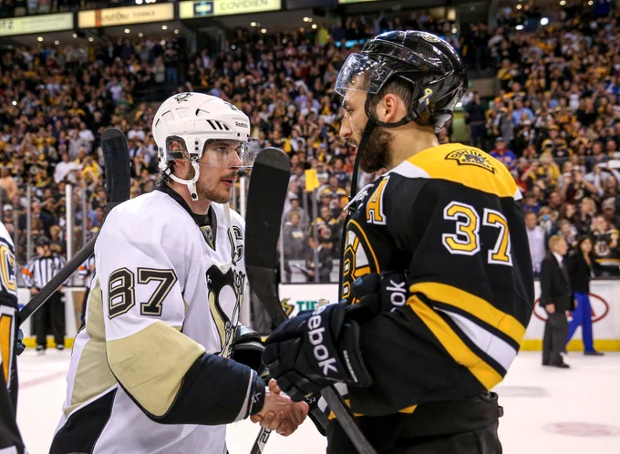 Crosby and Bergeron skate hands after a Penguins vs. Bruins game.