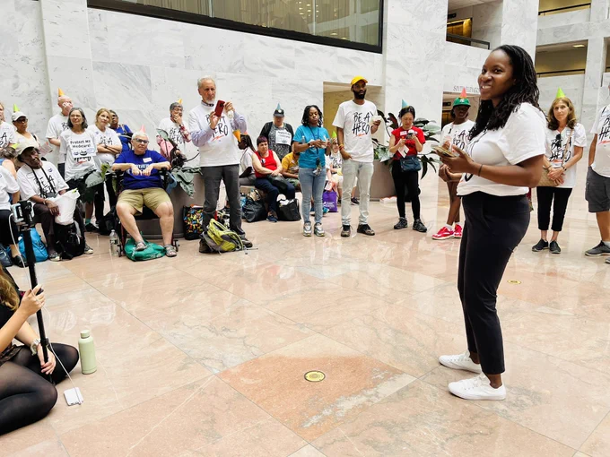 Jamila of Be a Hero leads our rally.