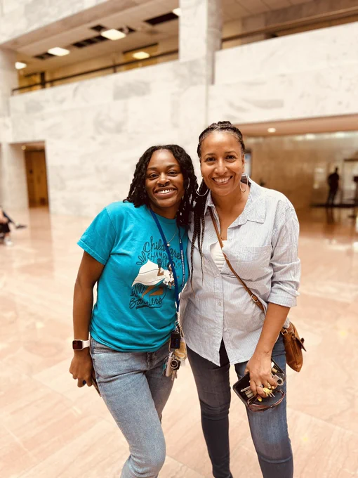2 CPD affiliate members smile together at our rally.