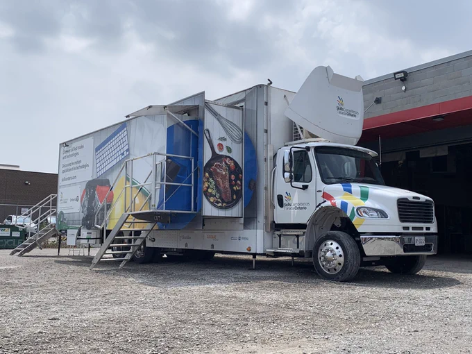 The front entrance and exit of the Trades & Tech Truck where participants can walk through the truck to explore the skilled trades activities inside.