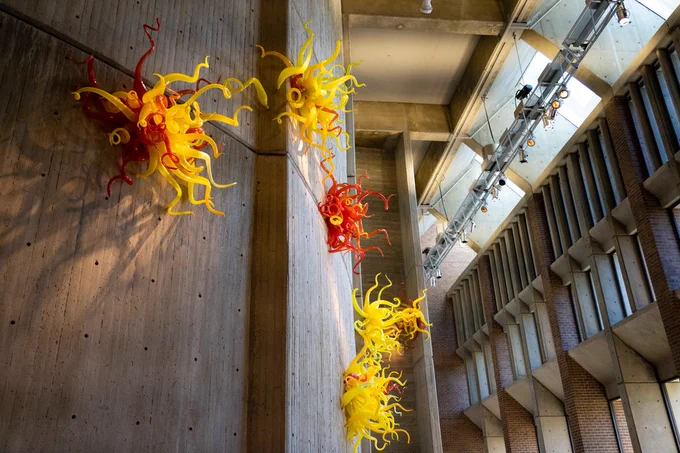 View of Dale Chihuly's 1996 piece entitled Six Starbursts on the wall in Meany's west lobby