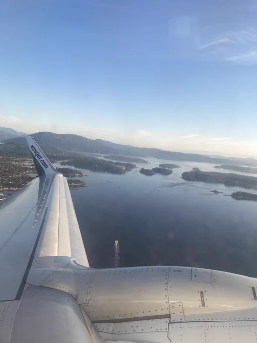 A window view from a WestJet flight looking out over the islands in Victoria, BC.