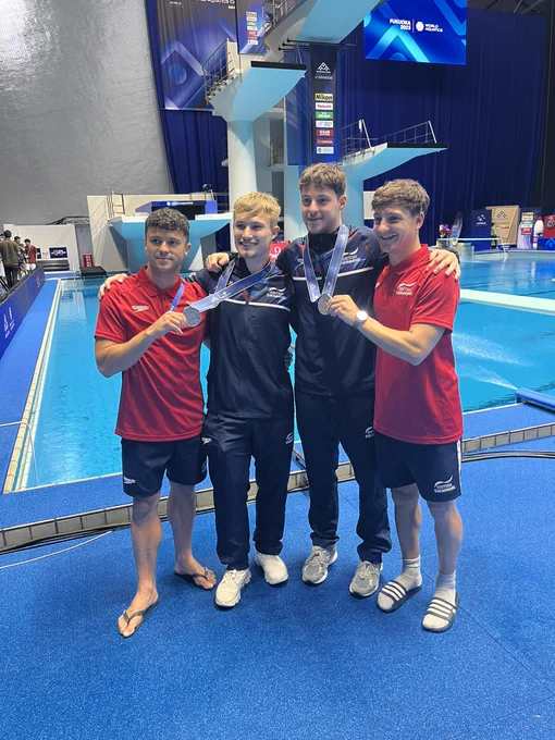 Jack Laugher and Anthony Harding have a medal picture with coaches Tom Owens and Adam Smallwood