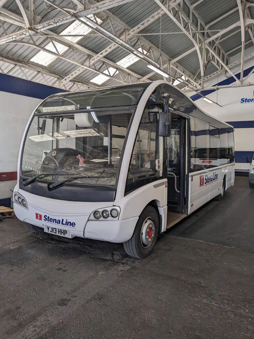 A photo of YJ13 HHP, an Optare Solo operated by Stena Line as a service to board the ferry between Fishguard and Rosslare. Taken in the Fishguard Ferry Terminal.