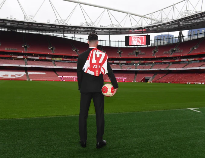 Declan Rice surveys the Emirates Stadium pitch during his unveiling.