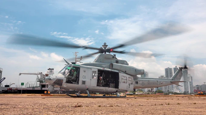 U.S. Marines with Marine Light Attack Helicopter Squadron (HMLA-775), Marine Aircraft Group 41, 4th Marine Aircraft Wing, wait in a UH-1Y Venom helicopter for a simulated casualty to be transported during a simulated medical evacuation exercise for UNITAS LXIV in Cartagena, Colombia, July 14, 2023. (U.S. Marine Corps photo by Lance Cpl. Mary Kohlmann)