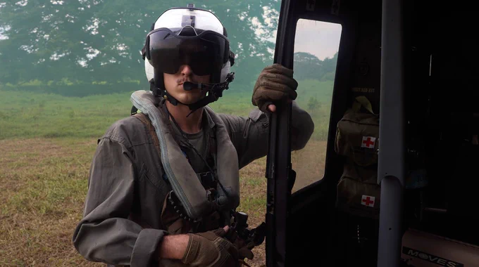 U.S. Marine Corps Lance Cpl. Ethan Walker, a crew chief, with Marine Light Attack Helicopter Squadron (HMLA-775), Marine Aircraft Group 41, 4th Marine Aircraft Wing, steps out of a UH-1Y Venom helicopter during a simulated medical evacuation exercise for UNITAS LXIV in Coveñas, Colombia, July 14, 2023. (U.S. Marine Corps photo by Lance Cpl. Mary Kohlmann)