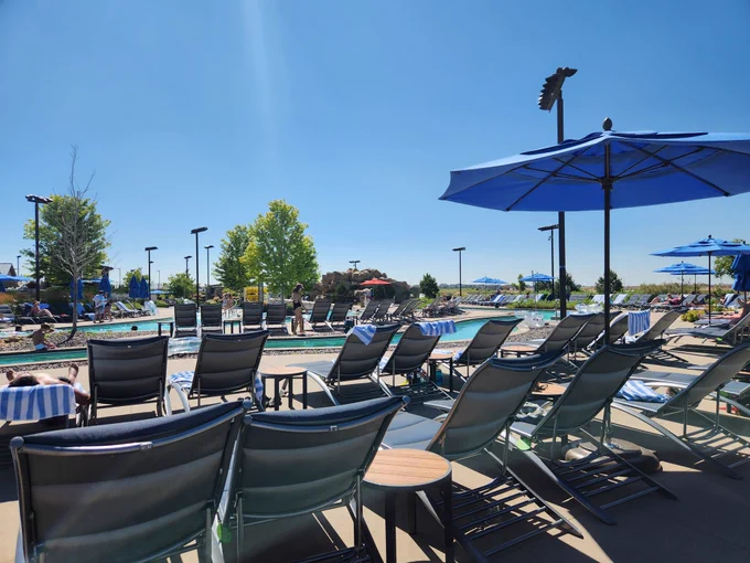 Image of lazy river and deck chairs