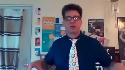 A photo of Jon Grahe, wearing an open science badges tie