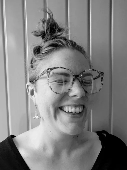 image of Bobi Robson, a female grinning, with her eyes closed 